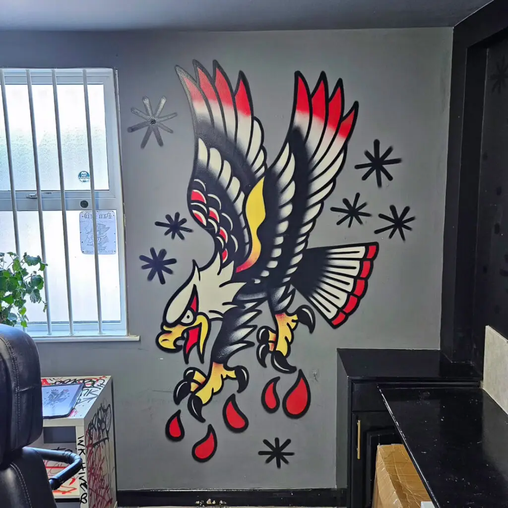 a wall with a drawing of an eagle
